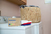 An image of laundry detergent sheets and washing machines