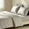 An image of a comfy bed with a duvet cover