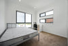 white mattress in an open undecorated room.