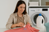 An image of a model getting laundry stains out of clothes