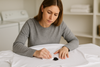 An image of a woman trying to get sharpie out of clothes
