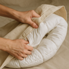 An image of someone putting a comforter inside a duvet cover