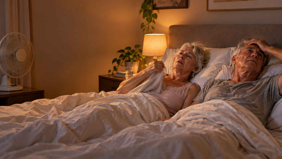 An elderly couple sleeping together feeling so hot.