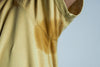 Yellow deodorant stains on cotton T-shirt underarm area