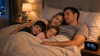 Family sleeping together on the bed.