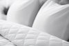 White quilted king-size comforter with plush pillow backing