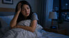 An asian woman who cannot sleep because her anxiety.