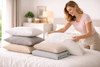 A woman stacking the pillow cases.