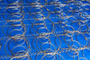 Worn mattress springs showing sagging support structure