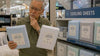 An old man choosing what is the best cooling sheets.