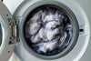 Washing machine drum filled with laundry.