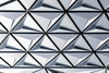 Natural silver geometric pattern with reflective triangular surfaces.