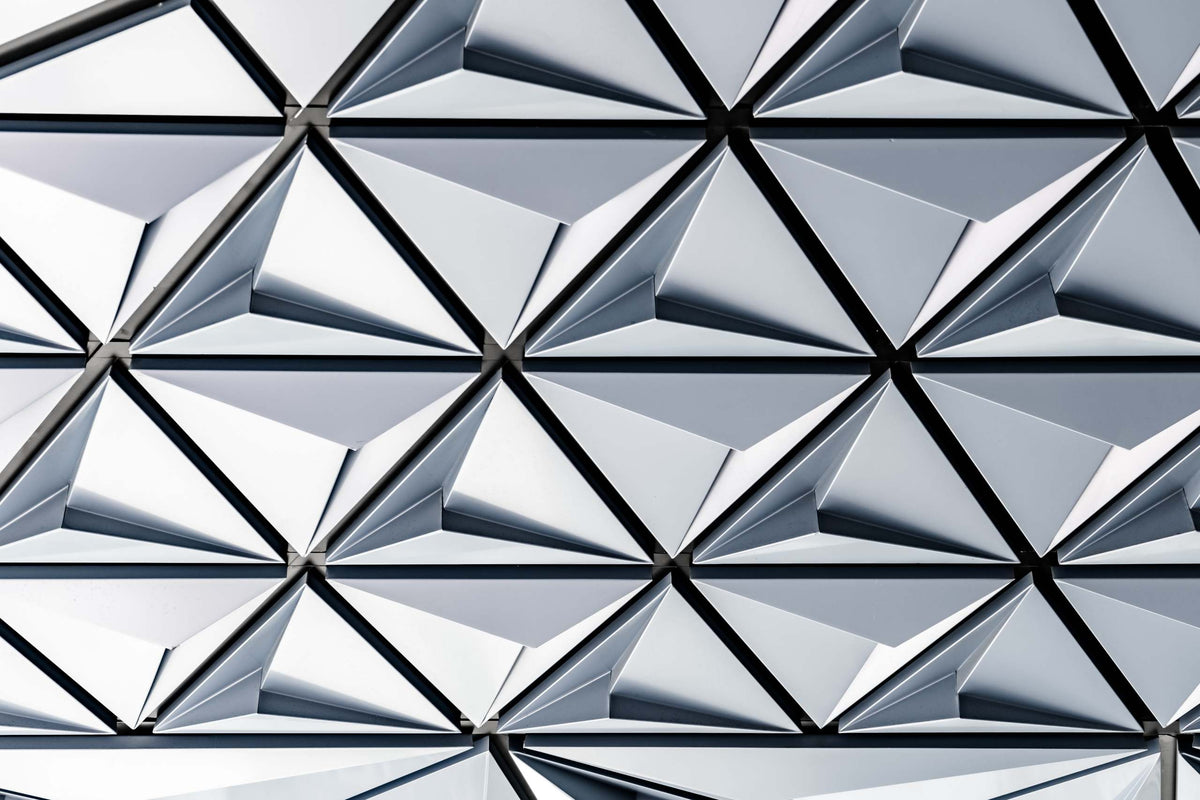 Natural silver geometric pattern with reflective triangular surfaces.