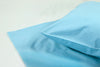Smooth silk pillowcase and bedsheet in soft blue tone