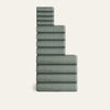 Stack of green checkered towels on a white background