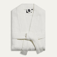 White textured robe on a light gray background