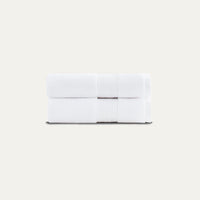 White folded fabric on a beige background