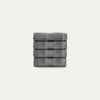 Stack of gray towels on a light gray background