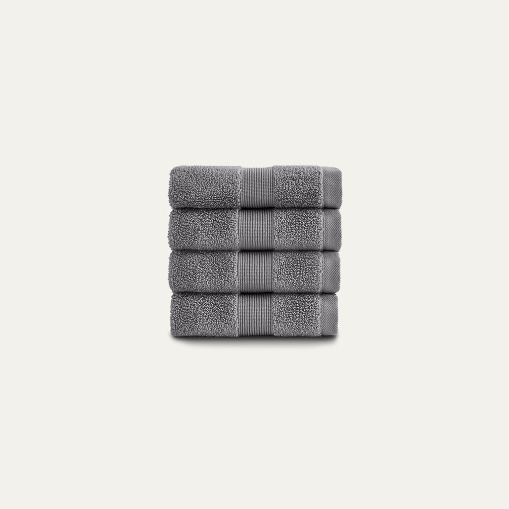 Stack of gray towels on a light gray background