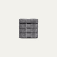 Stack of gray towels on a light gray background