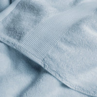 Close-up of a textured light blue fabric surface