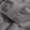 Close-up of gray textured fabric with a focus on texture and color.