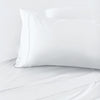 White pillow on a white bed