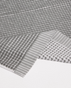 Gray textured fabric with geometric patterns on a white background