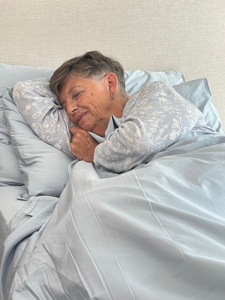 Customer asleep with her cheek against her pillowcase