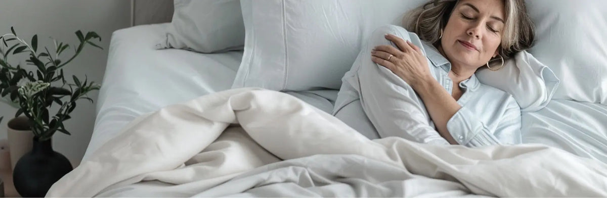 Woman sleeping comfortably in Miracle Made sheets