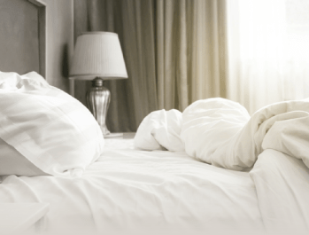 a bed with a lamp on it